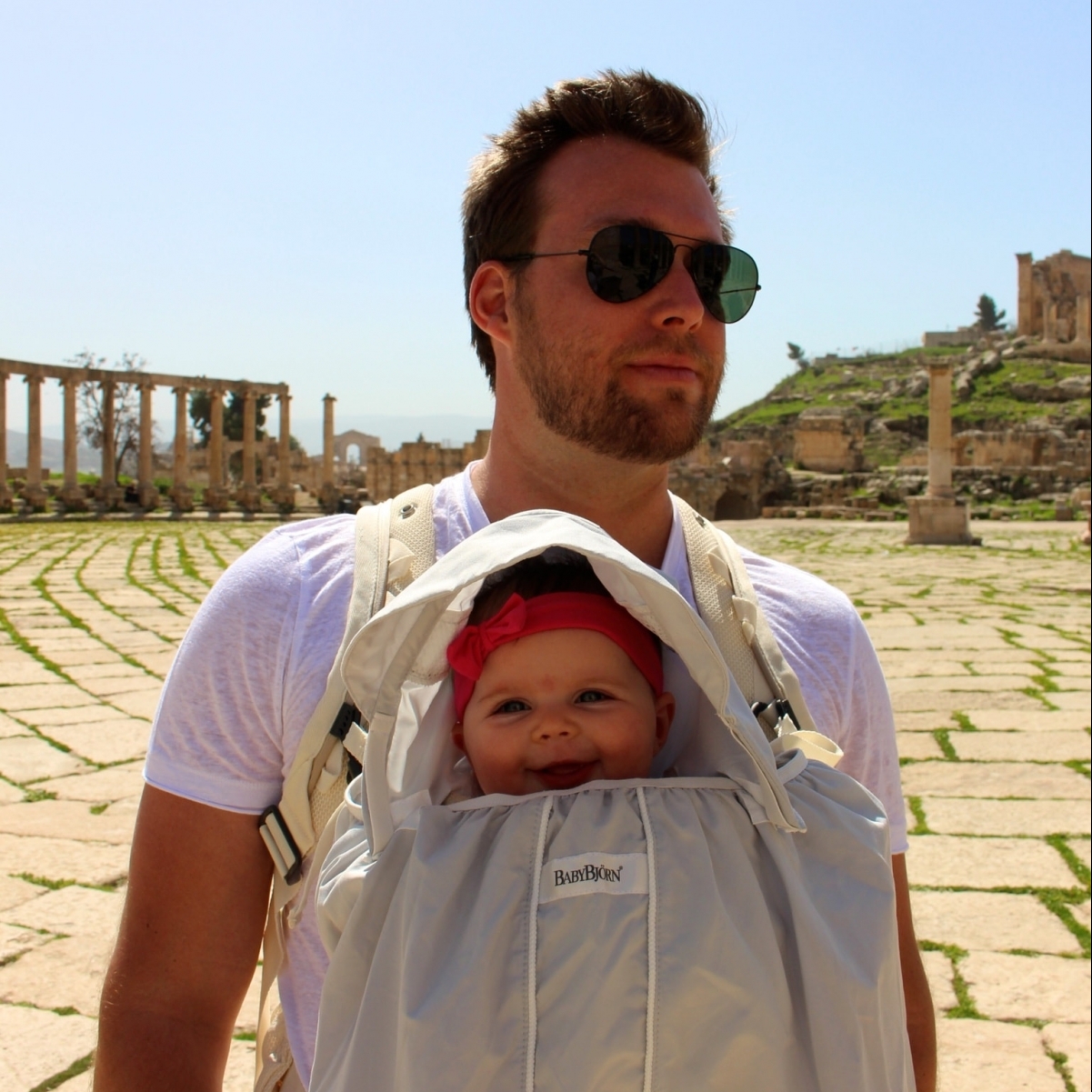 dad baby wearing baby bjorn sun shield