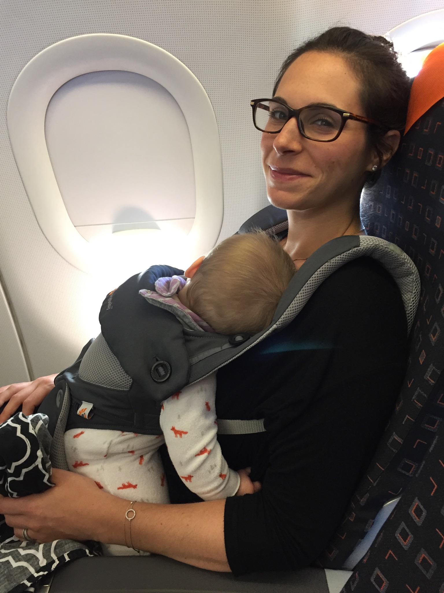 flying with a baby with baby wearing